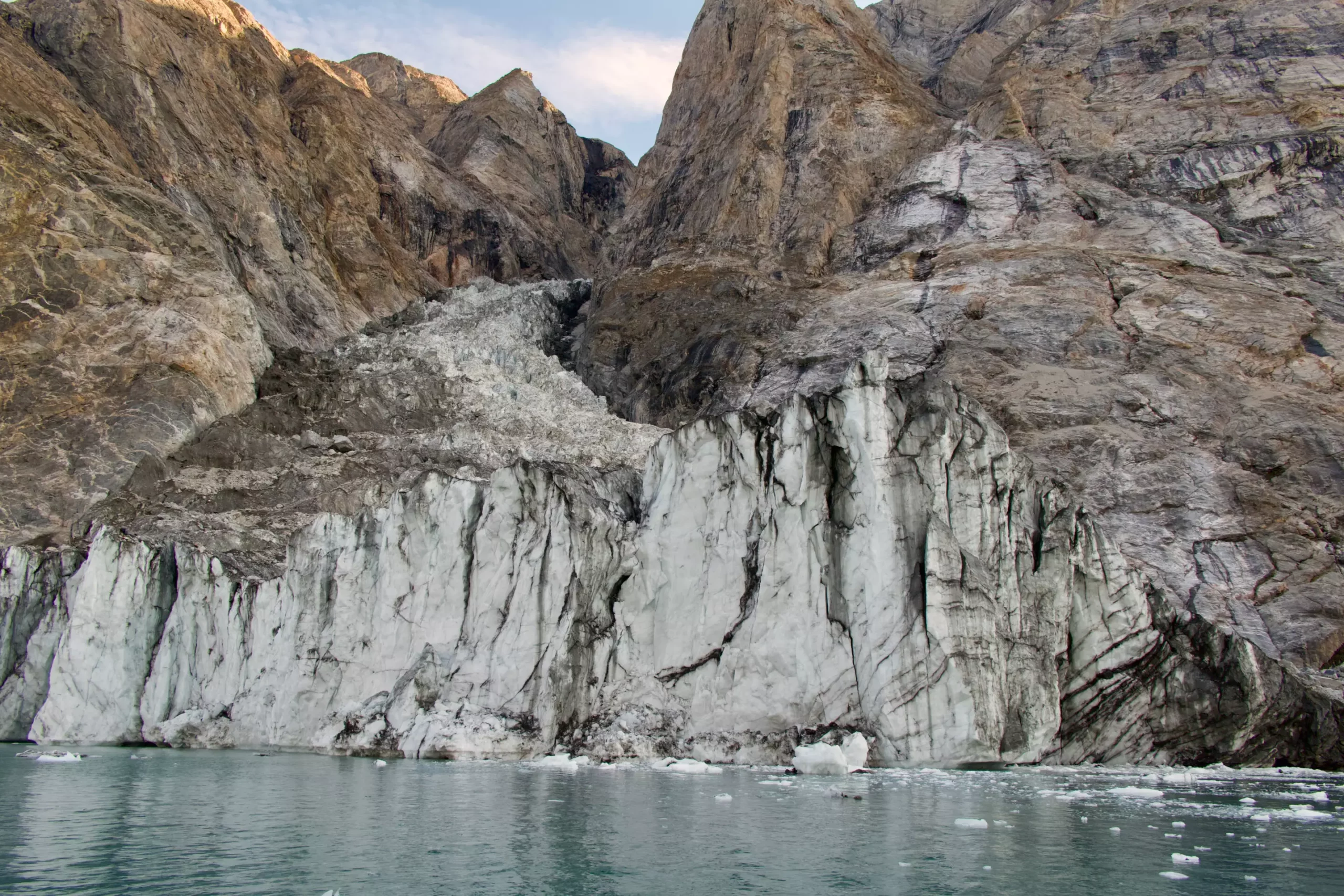 The Echoes of a Catastrophe: Understanding the Greenland Seiche Phenomenon